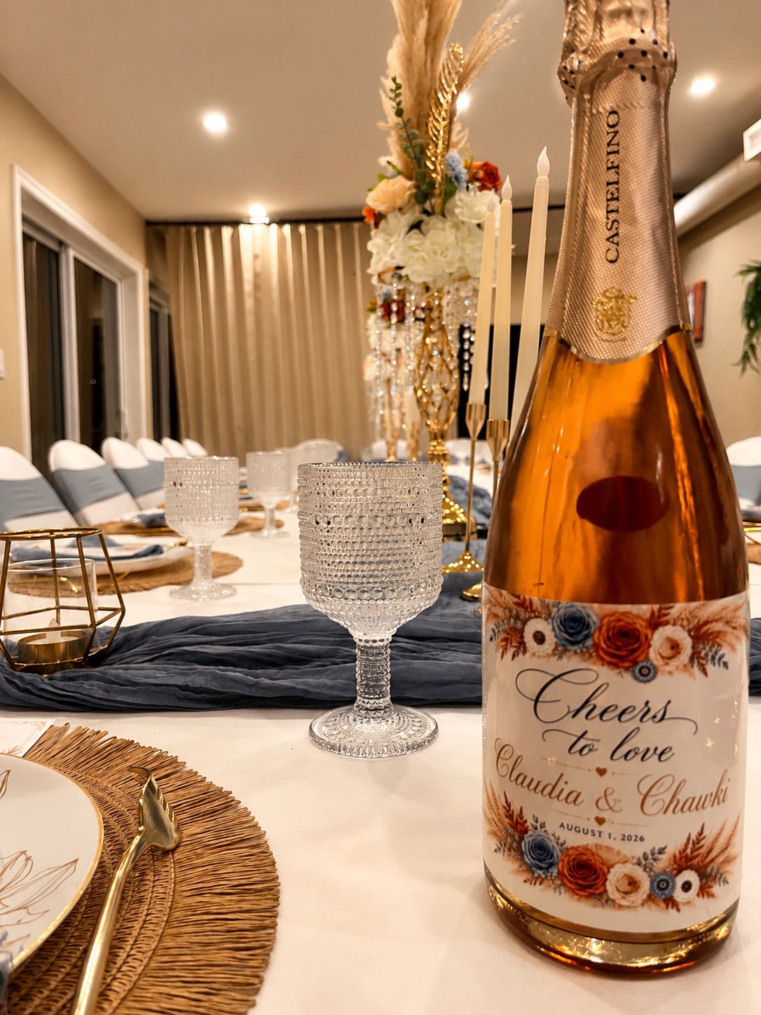 A styled celebration table in dusty blue and gold